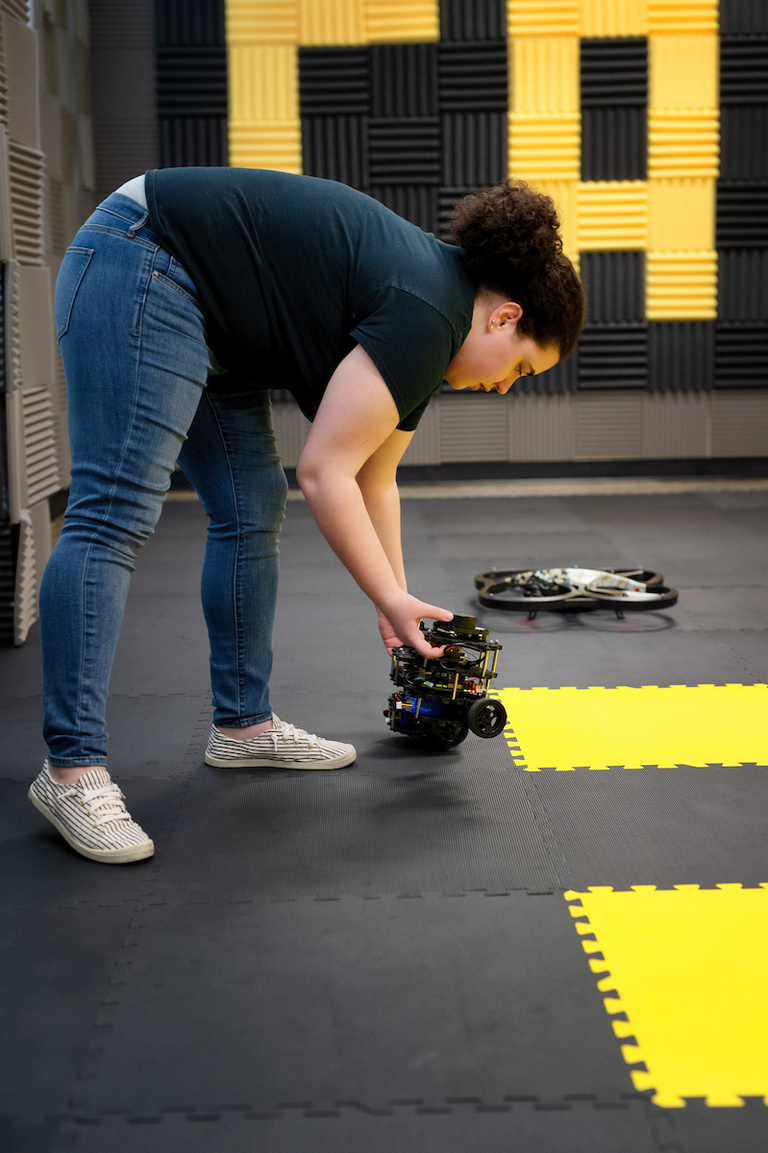 Camilla Tabasso adjusts an autonomous vehicle