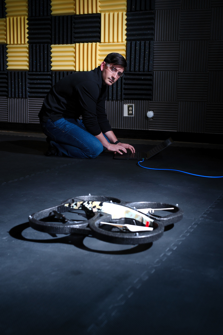 Calvin Kielas-Jensen works with an autonomous vehicle