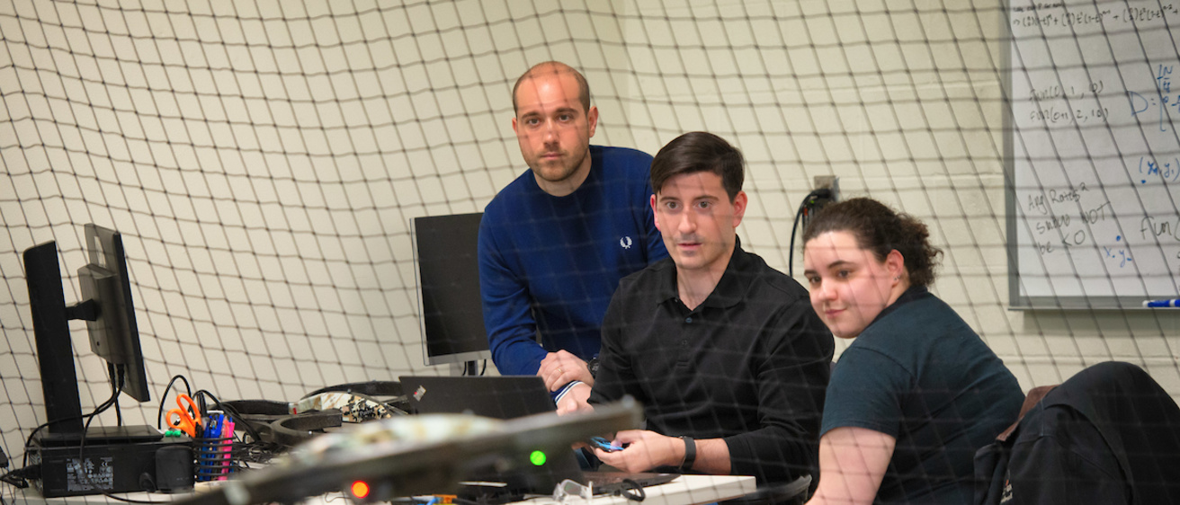 CAS Lab researchers watching an autonomous vehicle fly
