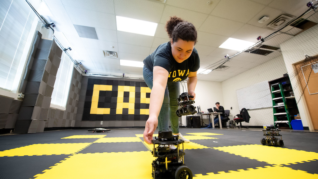 Camilla Tabasso adjusts an autonomous vehicle in the lab